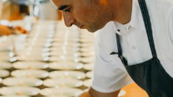 Chef preparing meal.